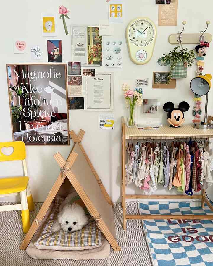 White wall and wood tone bedroom corner featuring a pet tent, dog wardrobe, and yellow furniture creating a bright, warm pet-friendly space