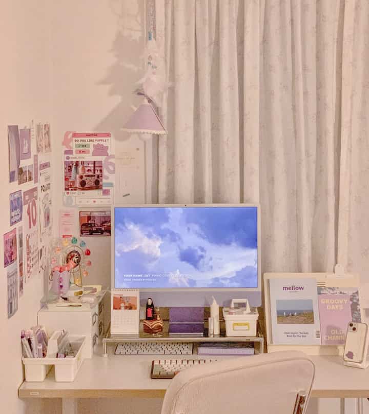 Warm beige and white toned home office featuring a neat desk and curtains, creating a cozy atmosphere