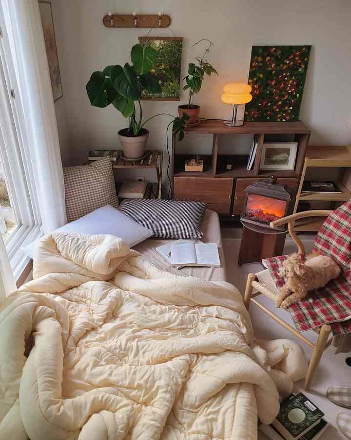 Natural beige and wood tone bedroom featuring cushions and plants with a cozy atmosphere