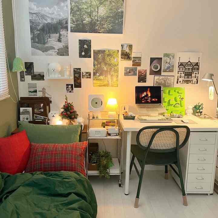 Natural green-toned small bedroom and home office space featuring bed and desk with a cozy, simple atmosphere
