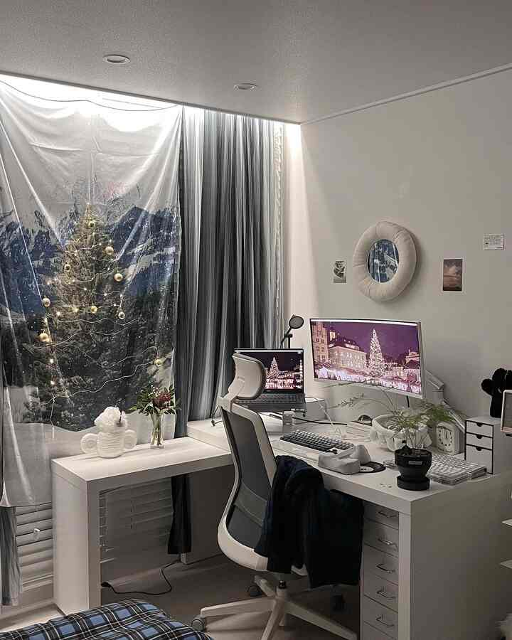 White-toned bedroom and home office featuring a clean white desk and ergonomic office chair in a cozy workspace