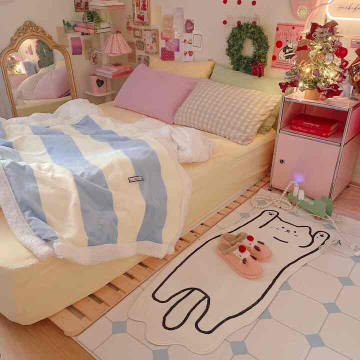 Cozy pastel and natural color bedroom featuring a cute character rug and Christmas decorations