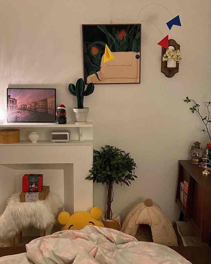 Natural-toned vintage mood living room featuring a fireplace console and a cat house creating a cozy atmosphere