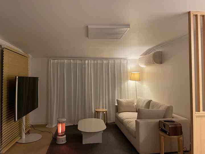 Cozy living room in white and beige tones featuring a beige sofa and a coffee table