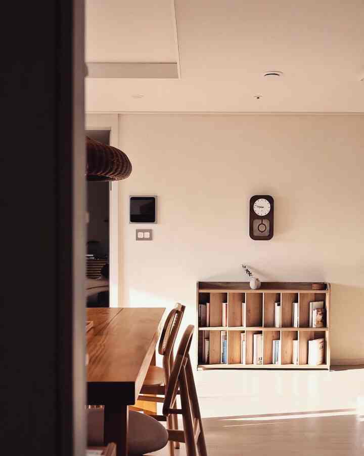 Beige-toned dining room featuring wood-toned furniture with a simple, natural atmosphere