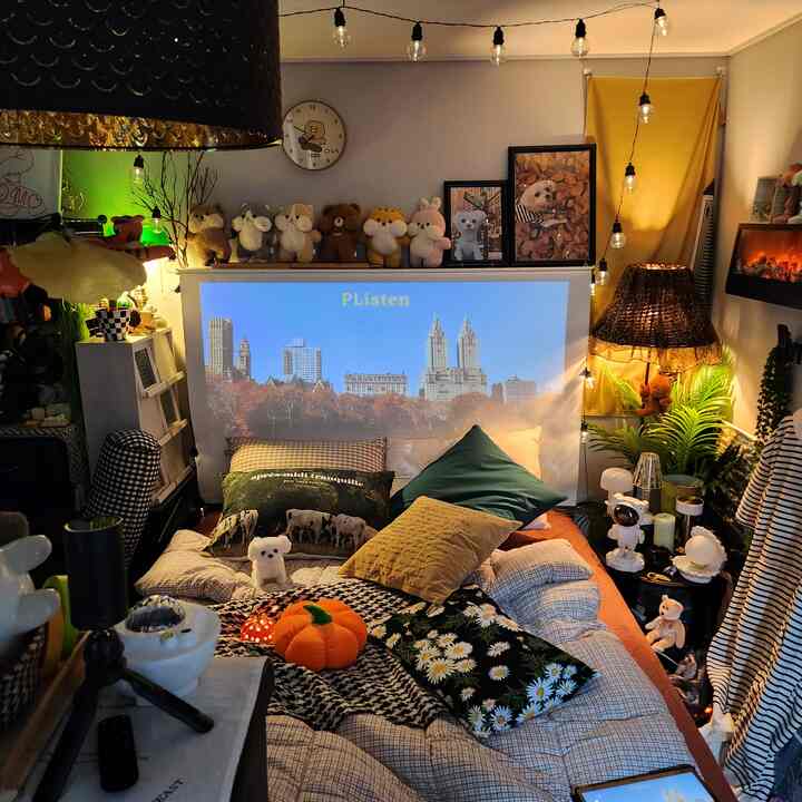 Cozy bedroom and home cinema featuring warm lighting, mood lights, and a floor lamp