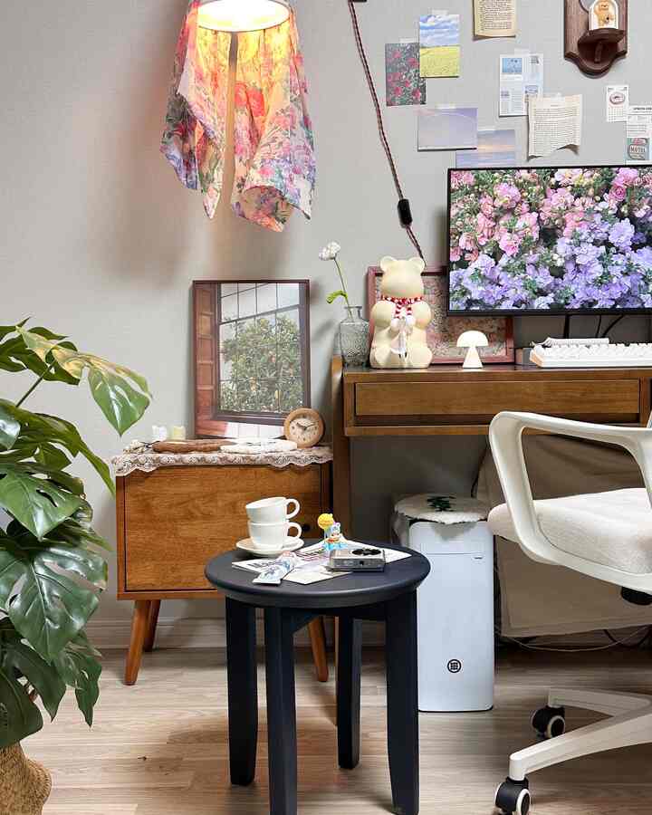 Beige walls and natural wooden furniture with a stool and white chair in a cozy living room interior