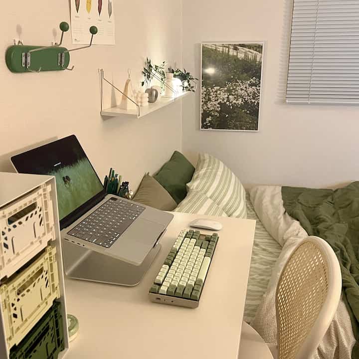 White and green toned 6-tatami bedroom featuring desk and bed in a cozy single household space