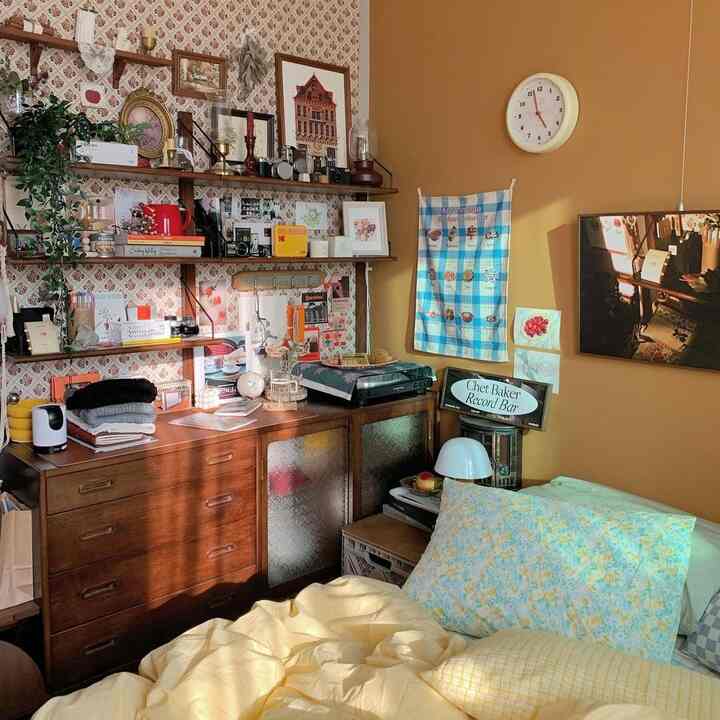 Warm wood-tone vintage bedroom featuring wall decor and smart storage ideas creating a cozy atmosphere