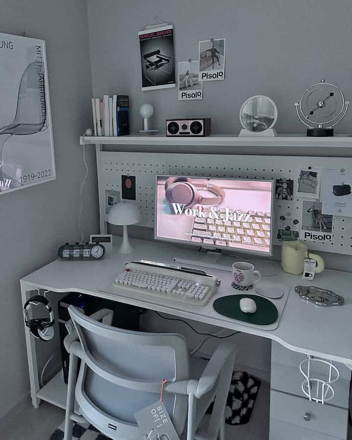 White-toned home office space featuring a clean desk and chair in a modern workspace