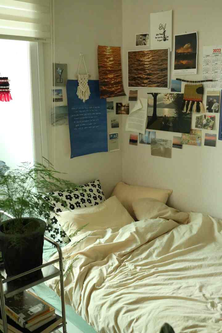Natural-toned bedroom space featuring beige bedding and various wall decorations creating a cozy atmosphere