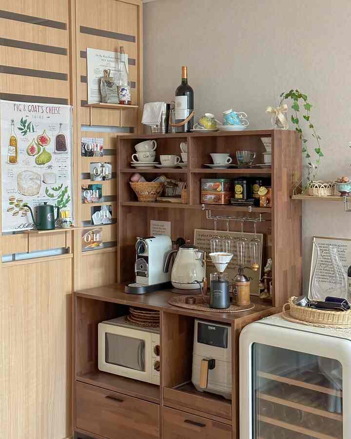 Cozy home cafe kitchen space with wood-toned walls and furniture, featuring a coffee machine and wine cellar in a neat arrangement