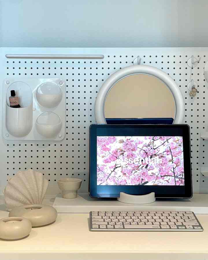 White tone home office desk featuring Apple keyboard and iPad in a modern, minimal workspace