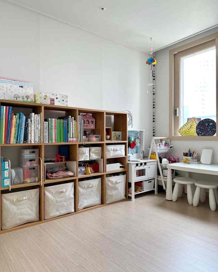 Natural color and white toned kids' room featuring bookshelf, children's desk, and organized storage items in a cozy setting