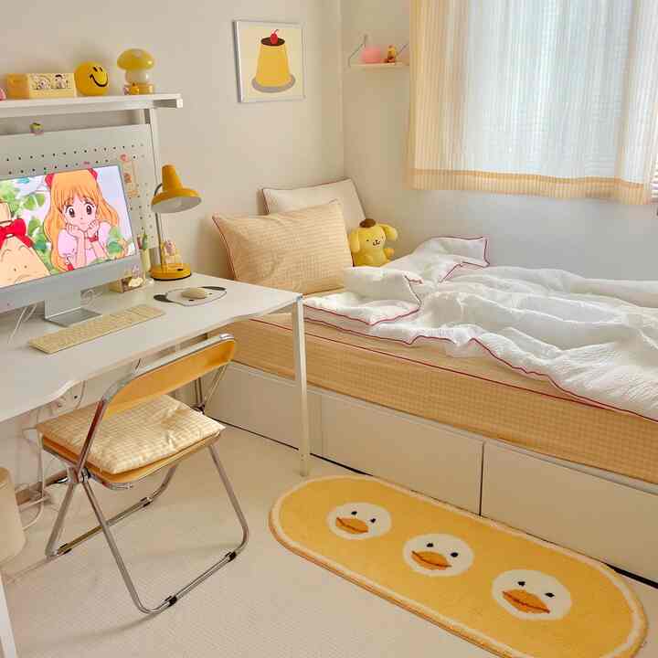 A yellow-toned kids' room featuring a desk, checkered bed, and cute accessories creating a cozy and lovely atmosphere