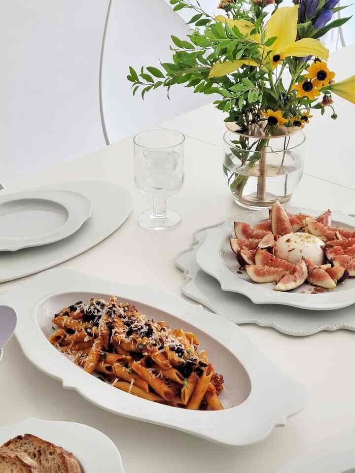 White-tone table with plates arranged in a clean, home cafe style plating setting