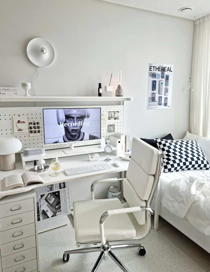 White-toned kids' room featuring desk, office chair, and bed with a minimal and clean aesthetic
