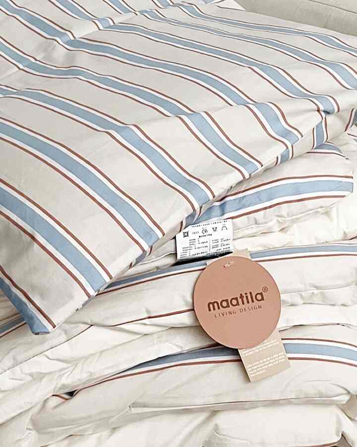 Soft ivory-based Nordic style bedding set for bedroom with light blue and brown stripes