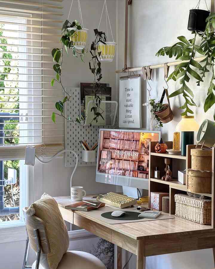 Natural wood-tone study with white walls, featuring a wooden desk and hanging plants in a cozy remote work setup