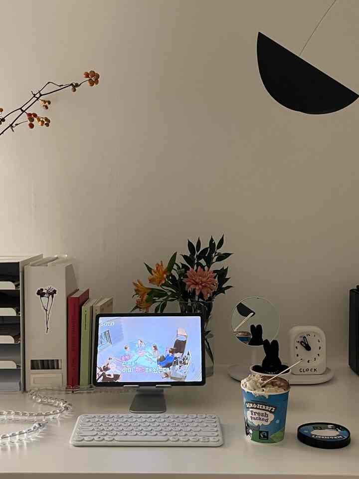 White-tone home office space featuring a neat desk with Galaxy Tab and wireless keyboard, creating a modern atmosphere