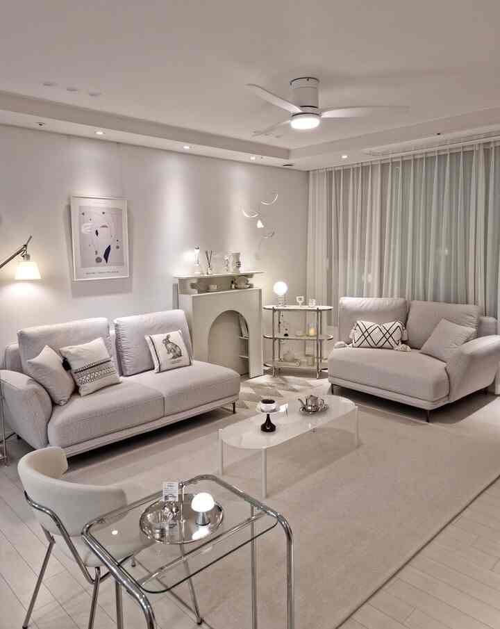 White tone living room featuring fabric sofas and rug with simple modern atmosphere