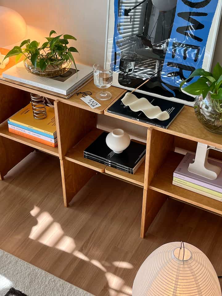 Natural wood tones and green plants in an interior accessories space with a simple, cozy atmosphere