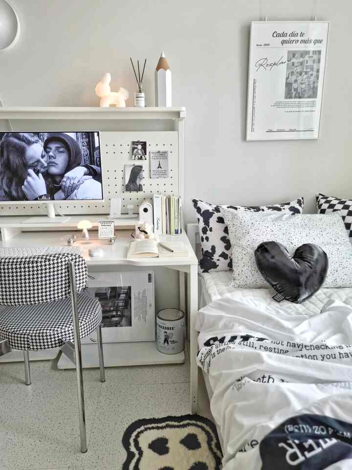 White and black toned kids' room featuring a desk and bed in a minimal modern style