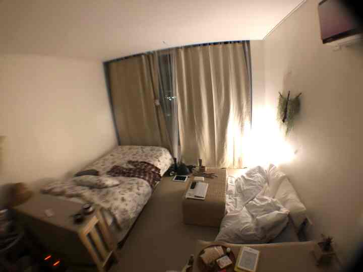 Natural tone bedroom for two featuring beige blackout curtains and bedding with a cozy atmosphere