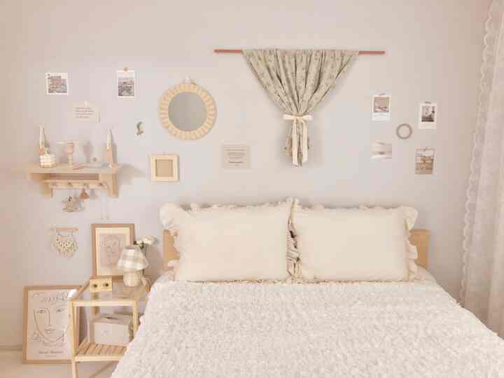 Natural beige-toned bedroom featuring wood tone nightstand and floral curtain with warm and cozy ambiance