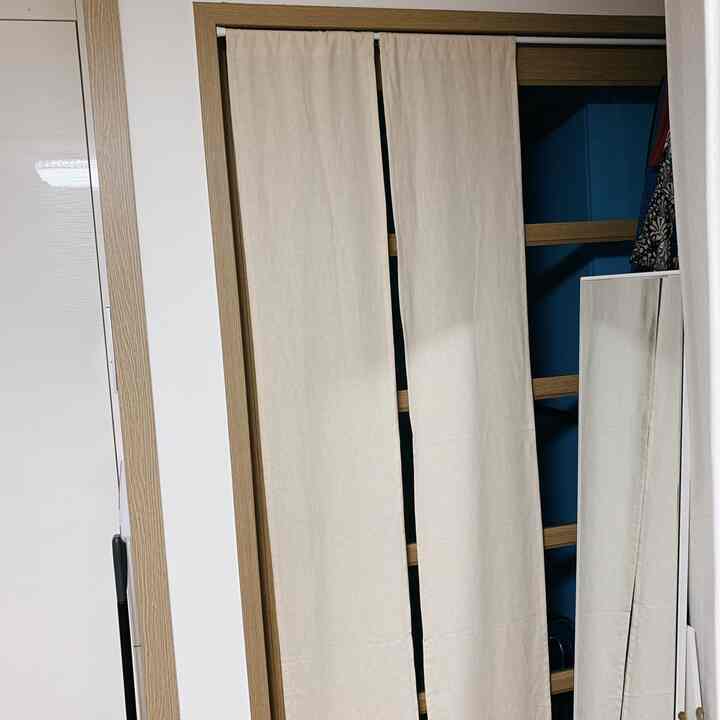 Ivory curtain installed on entrance door creating a cozy and private space