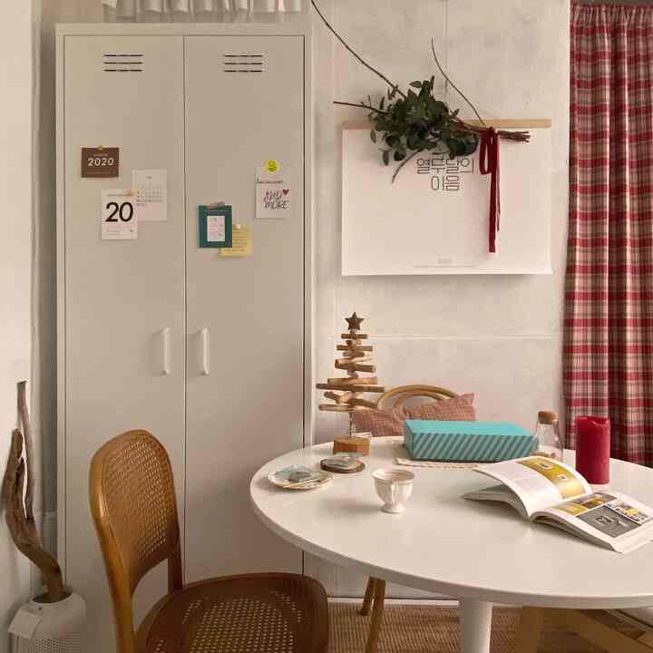 White and brown toned terrace home cafe featuring a round table and rattan chair with cozy natural atmosphere