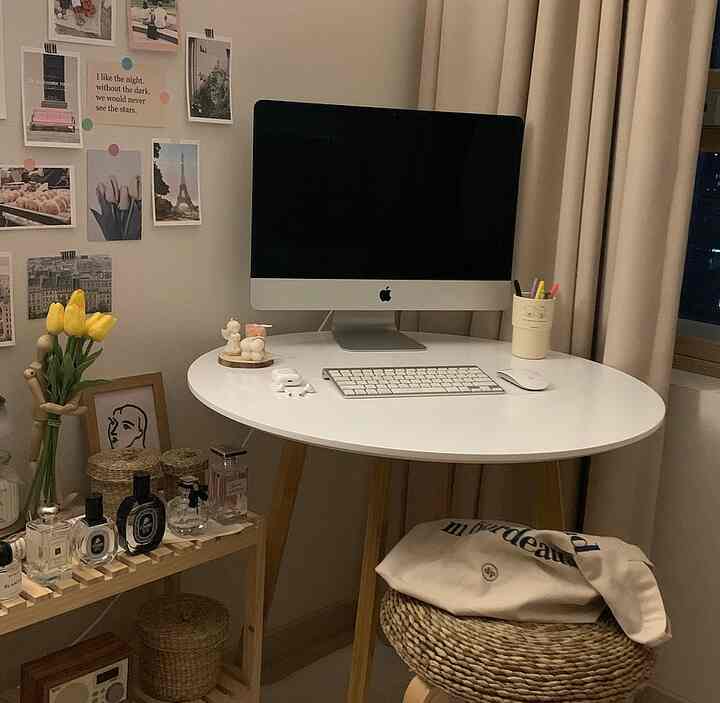 Natural and white tone home office space featuring a desk with a computer, creating a calm and functional atmosphere