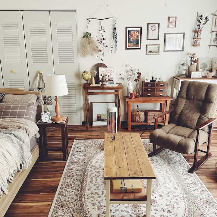 A warm and cozy living room featuring natural wood tones and vintage decorations with soft lighting
