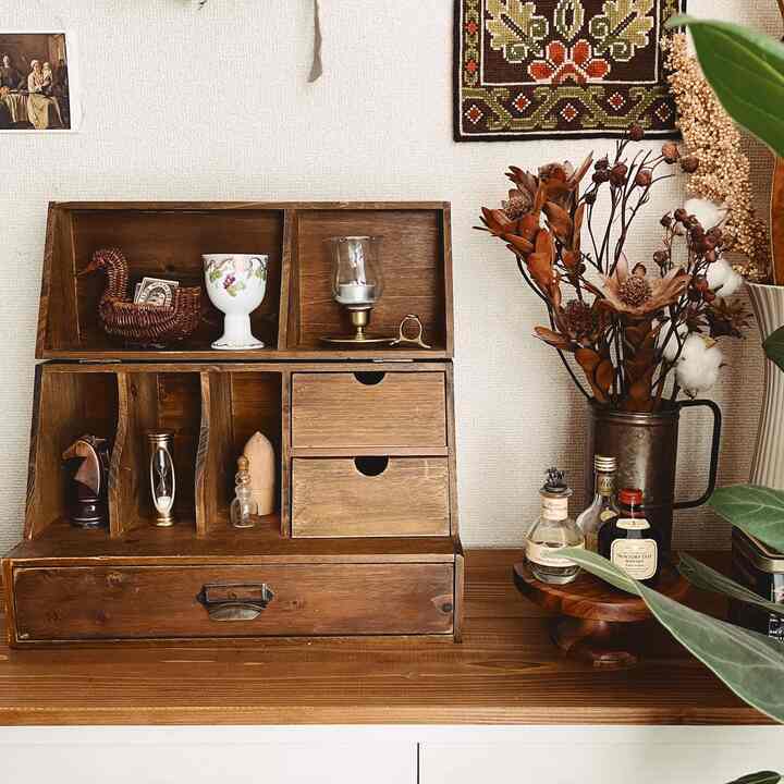 Cozy vintage-style space featuring wood tones and natural elements with decorative objets