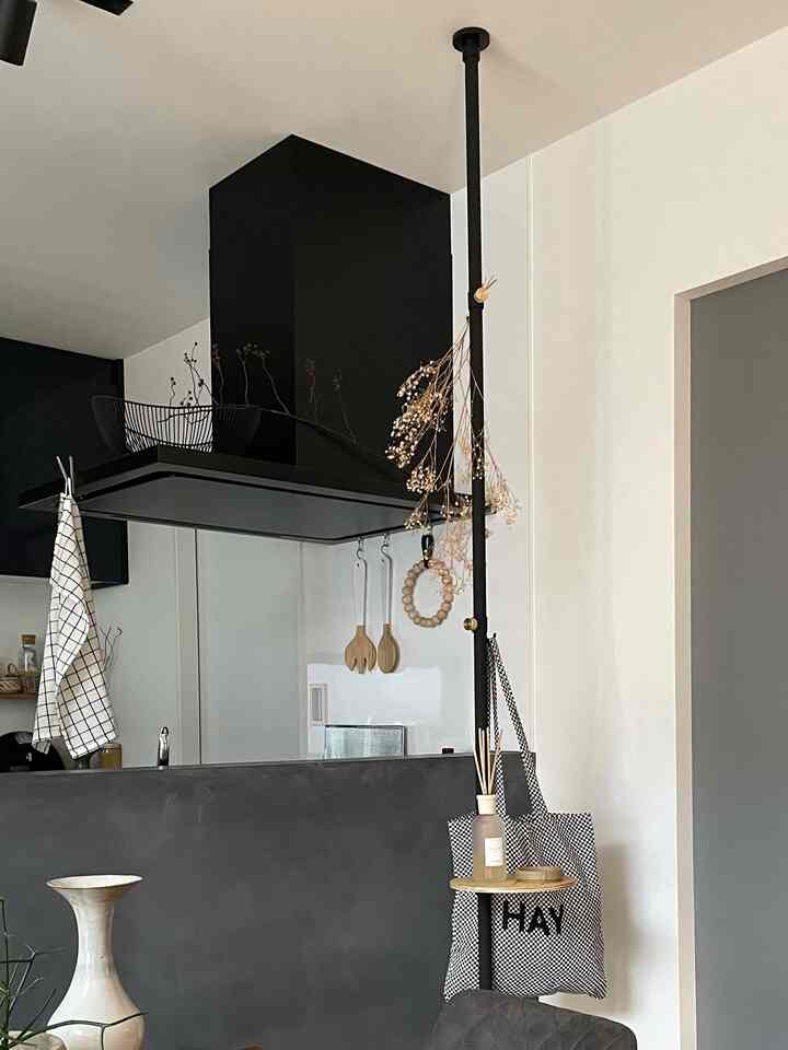 Black and white dining room featuring diffuser and natural decor in a simple styled space