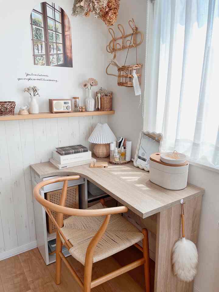Natural color toned single household corner desk space featuring storage ideas with cozy and organized atmosphere