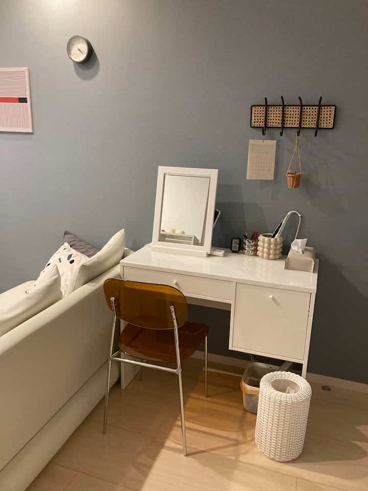 White and wood tone living room vanity space with simple and modern ambiance