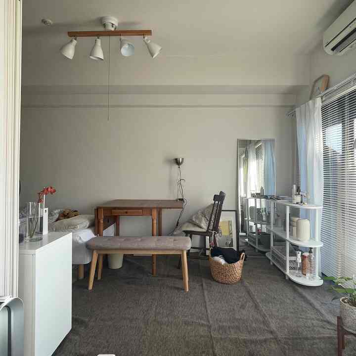 Soft brown and white toned dining room featuring wooden furniture and carpet creating a calm atmosphere