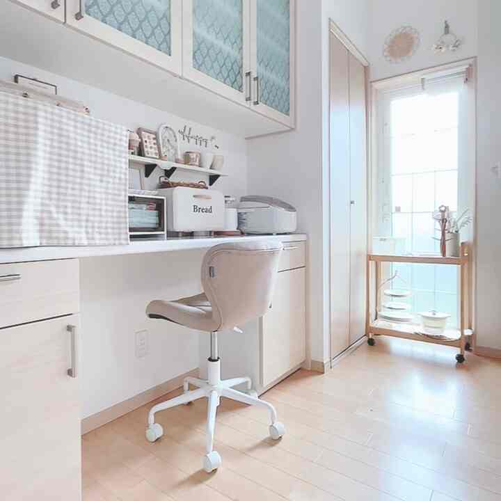 Bright white and light brown kitchen space featuring compact furniture and smart storage ideas with a clean aesthetic