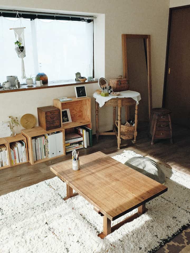 Natural wood-toned vintage living room for two, featuring warm wooden furniture and a cozy atmosphere