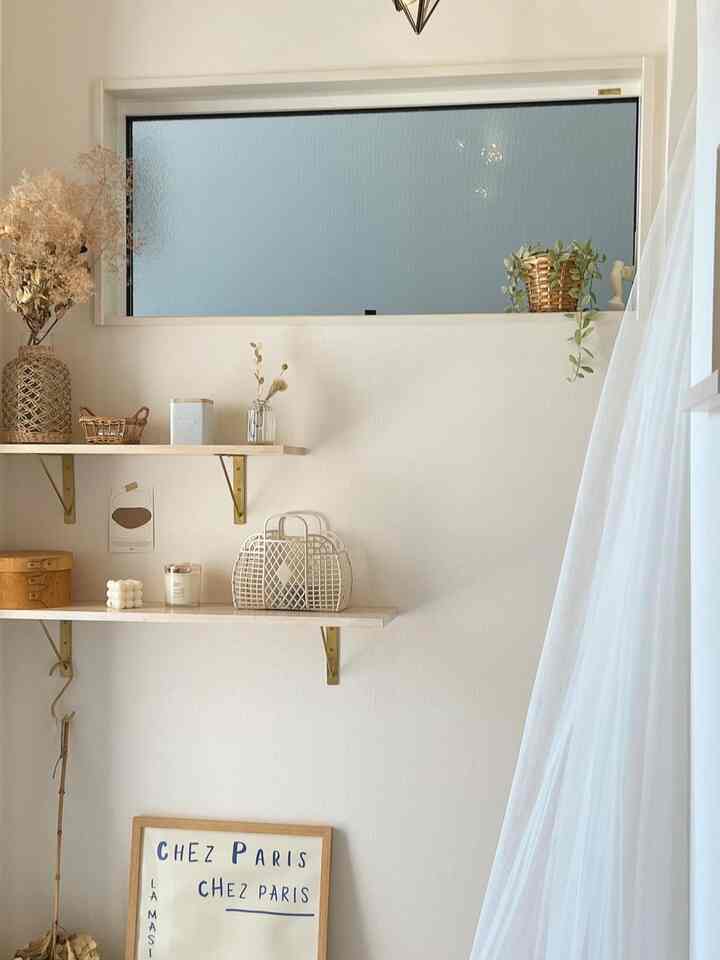 White and beige tone entrance space featuring wooden shelves and sheer curtains with a natural ambiance