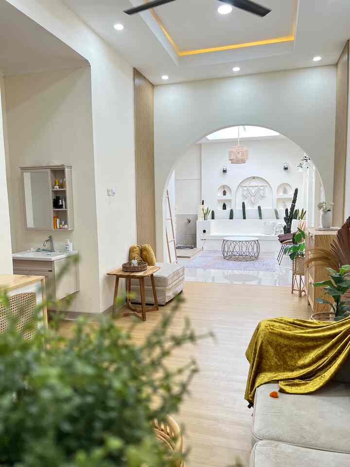 White and brown natural toned Japandi style living room featuring wooden furniture and a rug with a clean, bright atmosphere