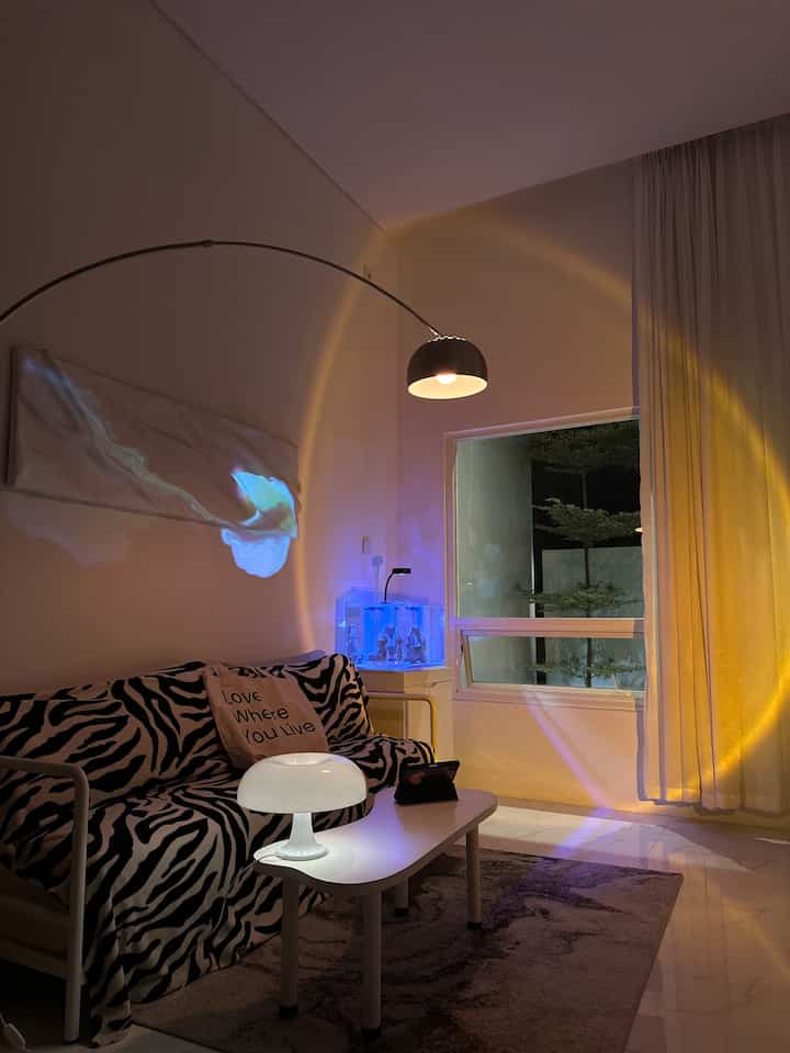 Night Vibe 
-
Pencahayaan yang kita gunakan di Living Room ada Mushroom Lamp, Sunset Lamp, Standing Lamp, Aquarium Lamp dan visual lamp dari smart projector

Ambiencenya terasa hangat, fantasi dihasilkan dari visual smart projector, untuk aquarium masih dalam masa growing bactery selama satu bulan masih kosongan belum ada ikannya. Kita gunakan warna biru untuk mengembangkan coral laut yang sehat ( nantinya diisi coral dan ikan laut ) 

Agar rumah tidak terlihat flat gunakan beberapa lampu yang mempunyai looks berbeda agar lebih bernyawa ketika malam hari

#NightVibe #LightIdeas #LightInspiration #Livingroom #homdecor #inspirasilivingroom #nightstyling #72sqm #angkahouse #homestagram #homecafe 