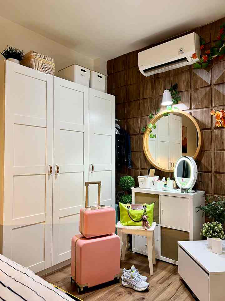 Natural wood tone and white bedroom featuring large wardrobe and vanity with cozy storage ideas