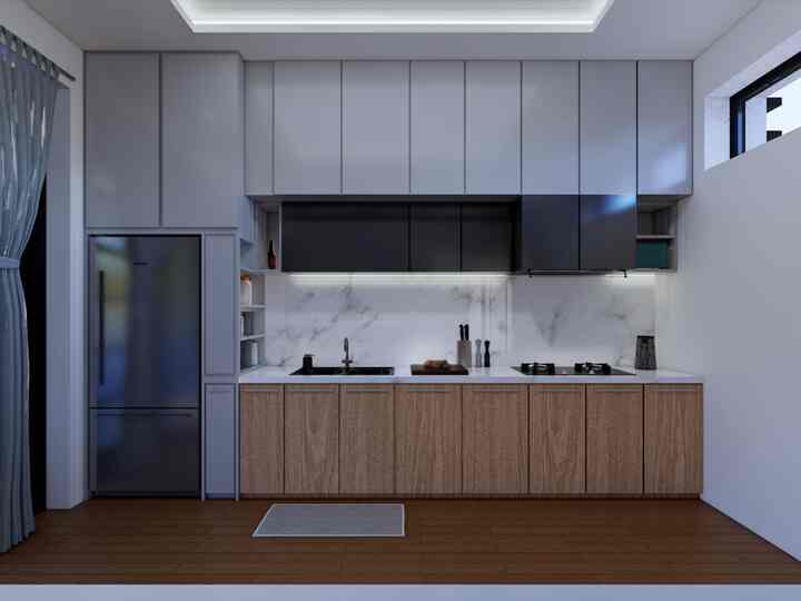 Modern kitchen featuring gray and wood tone cabinets, simple cabinetry and under-cabinet lighting in a clean and elegant space