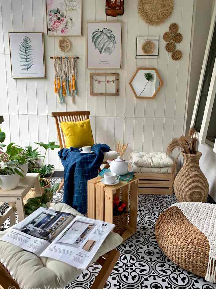 Natural-toned living room featuring wooden furniture, plants, and wall decor creating a cozy cafe-style interior
