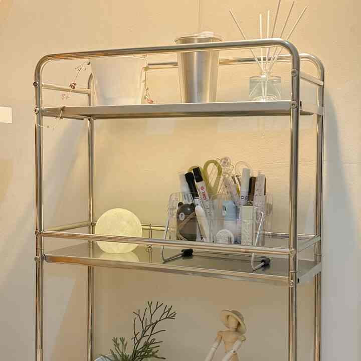 Silver stainless steel 3-tier trolley rack featuring moonlight LED lamp and diffuser in a clean storage setup