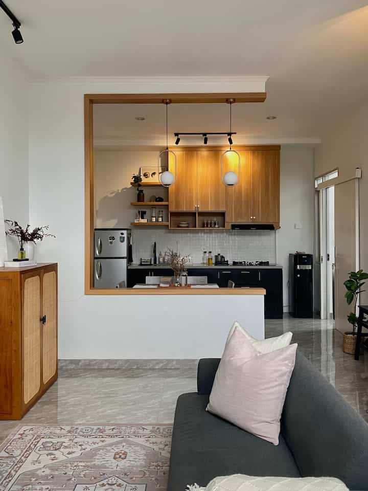 Alasan kami menempati rumah ini karena kami sudah cukup merasakan lelahnya mengontrak rumah dan harus berpindah-pindah tempat, makanya kami memutuskan untuk merenovasi rumah ini. Lokasinya di dalam cluster di mana terdapat one gate system jadi keamanan tetap terjaga. 

Yg kami ubah dan tambah dari rumah kami ini yaitu menambahkan adanya area kitchen dan sedikit memperluas area bathroom. Kami juga membuat sekat pemisah ruangan yg minimalis untuk pemisah antara ruangan living room dengan kitchen area. Selain itu, tembok kecil seperti sekat (slide 2) juga kami pilih seperti itu agar bisa kami taruh lampu spotlight sebagai dekoratif ruangan jika malam hari dinyalakan.

Definisi rumah ideal untuk kami adalah kami ingin menciptakan rumah yg nyaman, yg selalu bisa kami rindukan untuk pulang ketika sedang berpergian. Rumah yg bisa menjadi hobi kami dalam menata / menstyling ruangan, walaupun hanya dengan barang dekoratif yg low budget 🤎

#MyHomeStory #MyHomeJourney
#HomeSweetHome #rumahminimalis #homestagram #inspirasirumah #rumahmodern 