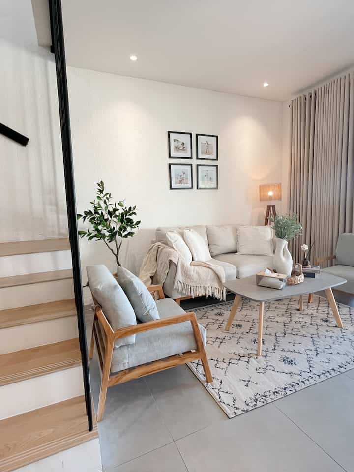 Natural color and wood tone living room featuring beige sofa and coffee table with a cozy atmosphere