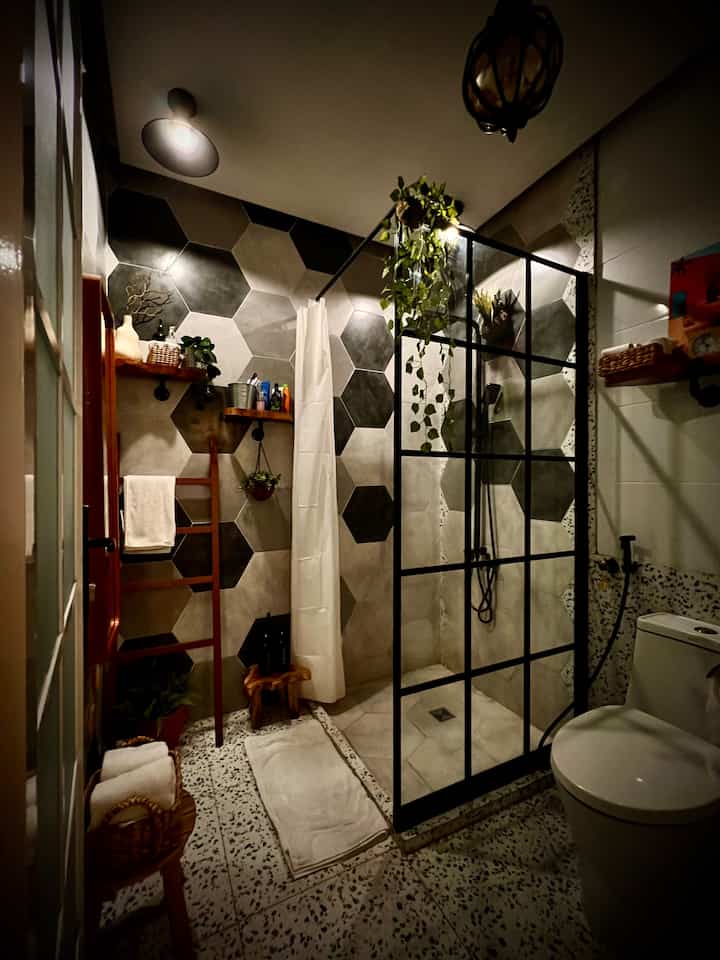 NIGHT VIBES at Jungle Bathroom 😂

Pengennya Jungle Bathroom, tapi mau dikasih tanaman lebih banyak, kok malah jadi sempit 😀.
Krn jungle, maka aku pengen terlihat lebih estetik, jadi aku ciptakan sinar remang2. Jadi ada 2 jenis lampu di kamar mandi ini, yg remang2 dan terang. Aku suka yg remang2 krn terlihat lebih estetik 

Jenis pencahayaan cukup dari lampu LED warna kuning dan Kap Lampu Plafon cari yg estetik

Sedikit tips untuk lighting interior (Kamar Mandi) :
- untuk suasana estetik, cari lampu led warna kuning, boleh yg susu atau transparan, dengan watt yang tidak terang dan tidak juga gelap.
- Harus ada 1 lampu putih yg lebih terang untuk cadangan saja, ketika kita ingin mencari benda2 di ruangan itu. Krn lampu remang2 agak sulit pandangan mata ketika butuh mencari2 benda
- Area Mandi (bathup/shower) ciptakan suasana yg lebih remang2
- Area Closet BAB, tambahkan cadangan lampu yg lebih terang
- Jika ada cermin di kamar mandi, tambahkan lampu tepat di atas cermin
- Jangan lupa untuk selalu jaga kebersihan di ruangan apapun ❤️

1. #NightVibe
2. #LightingIdeas
3. #LightingInspiration

#bathroom #kamarmandi #kamarmandi2x2m #kamarmandiestetik #tempattissue #tempatserbet #dingklik #bangkukayu #bangkukecil #kesetkamarmandi #keset #kesethanduk